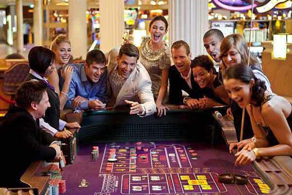 Quantum of the Seas casino with guests at gaming tables