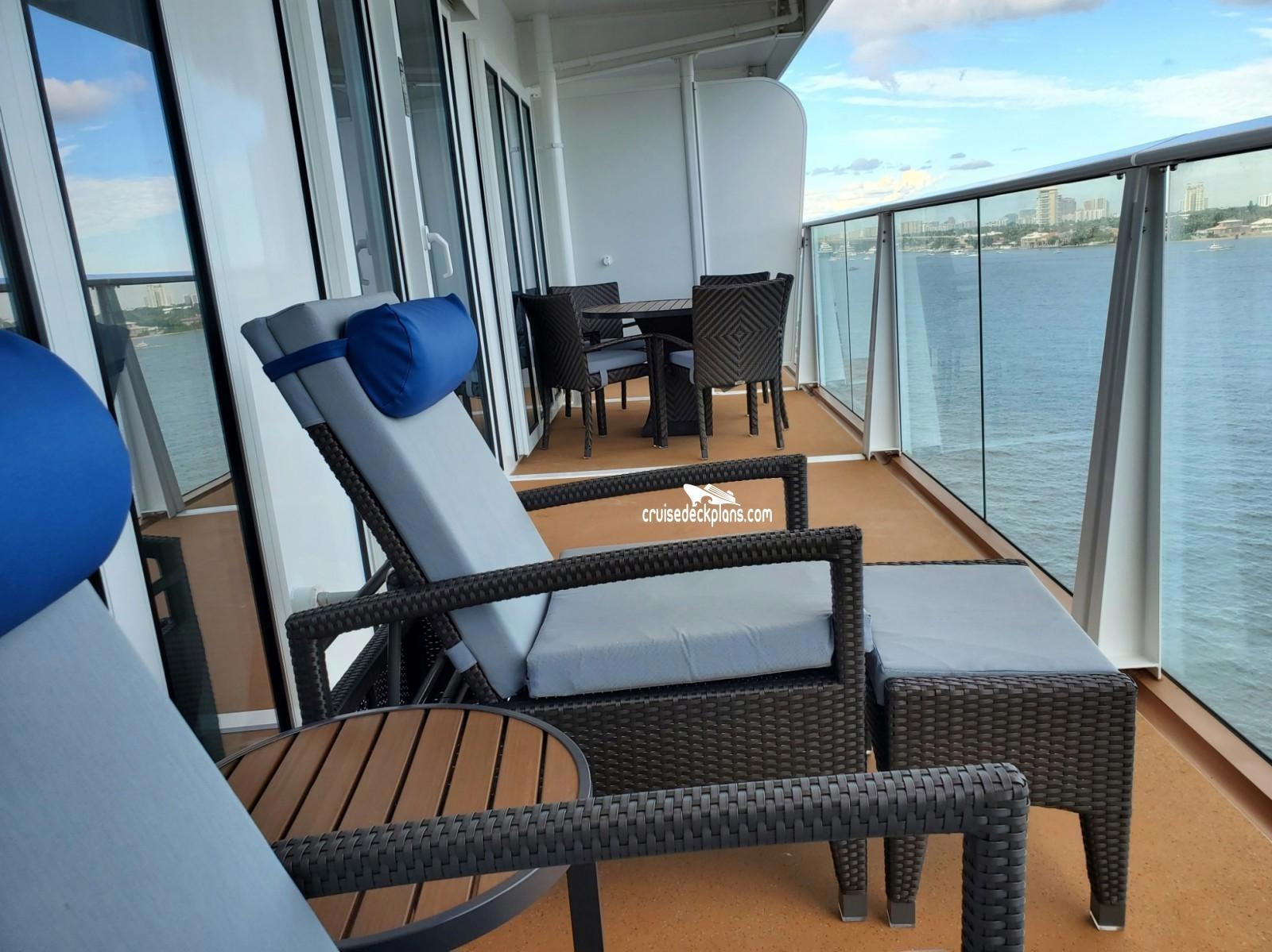 Quantum of the Seas suite private balcony with lounge chairs and ocean views
