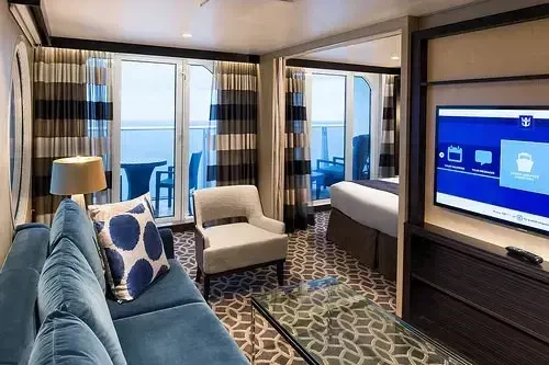 Quantum of the Seas suite bedroom with ocean view balcony