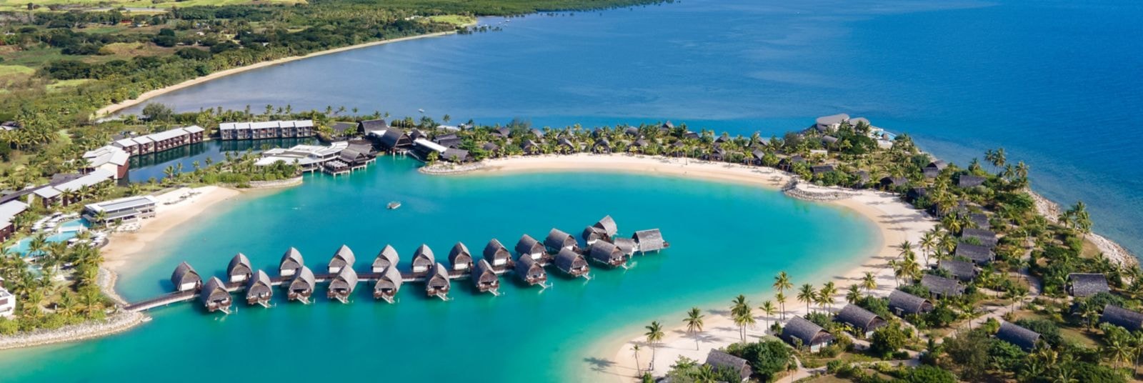 Aerial view of Fiji Marriott Resort Momi Bay with turquoise lagoon