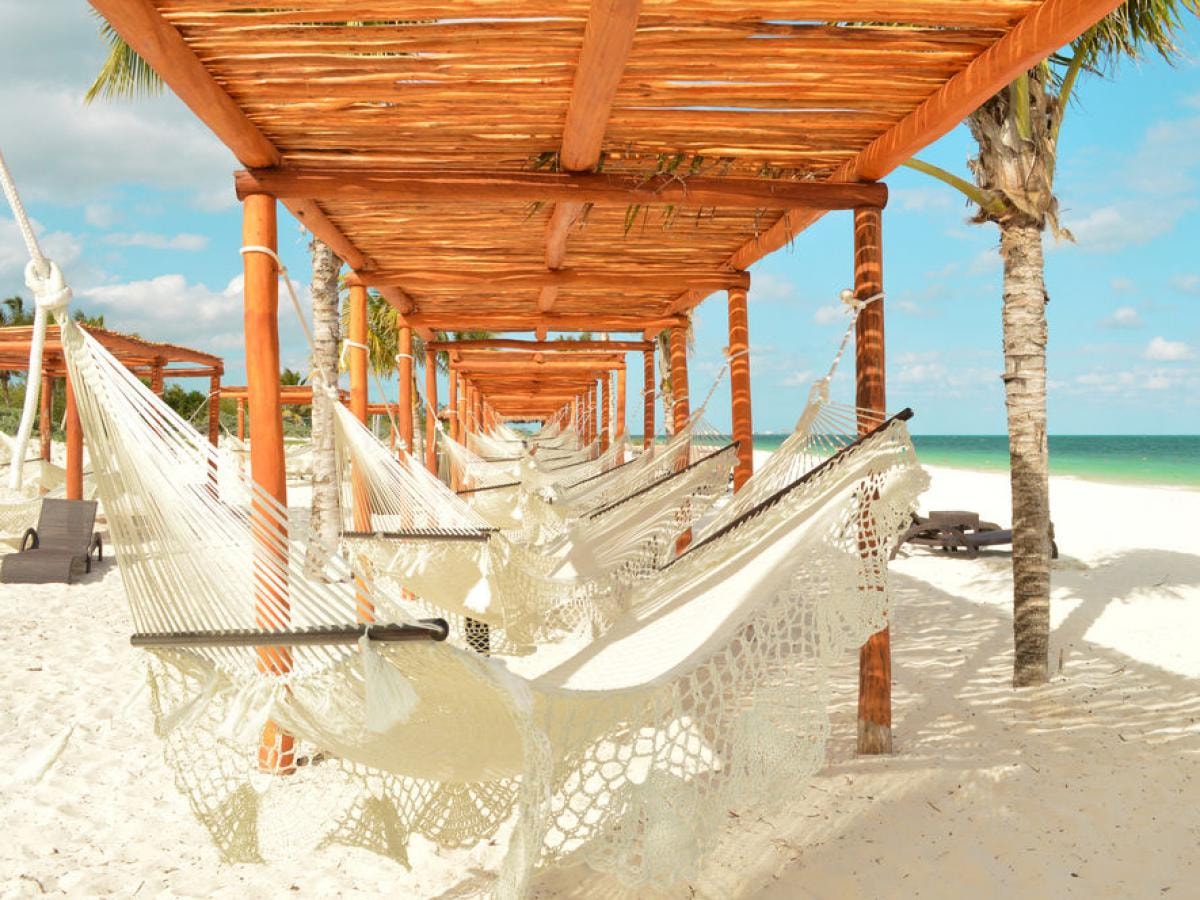 Beach hammocks and pergolas on the white sand beach